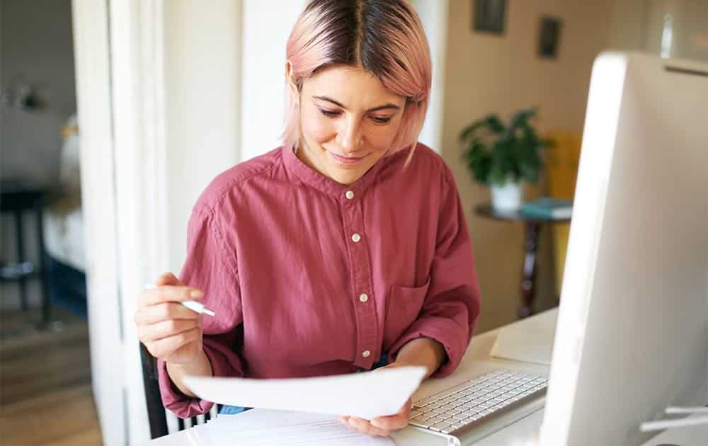 Of course. Based on the provided section and the image of a focused woman learning, here are the alt text and a compelling caption. (Note: In this context, an "SEO Caption" is the visible text below an image that provides context for readers and helps with on-page SEO by reinforcing key ideas.) Alt Text Text: A professional woman sits at her desk, focused on her computer and taking notes, engaged in a rigorous online training program.