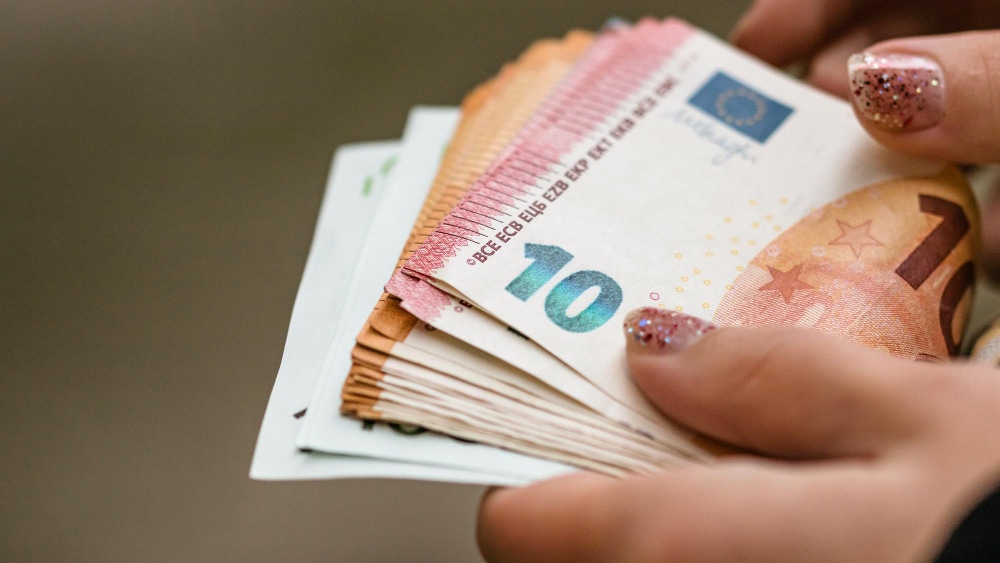 Remote executive assistant salary in Europe showing professional enjoying competitive compensation and location flexibility