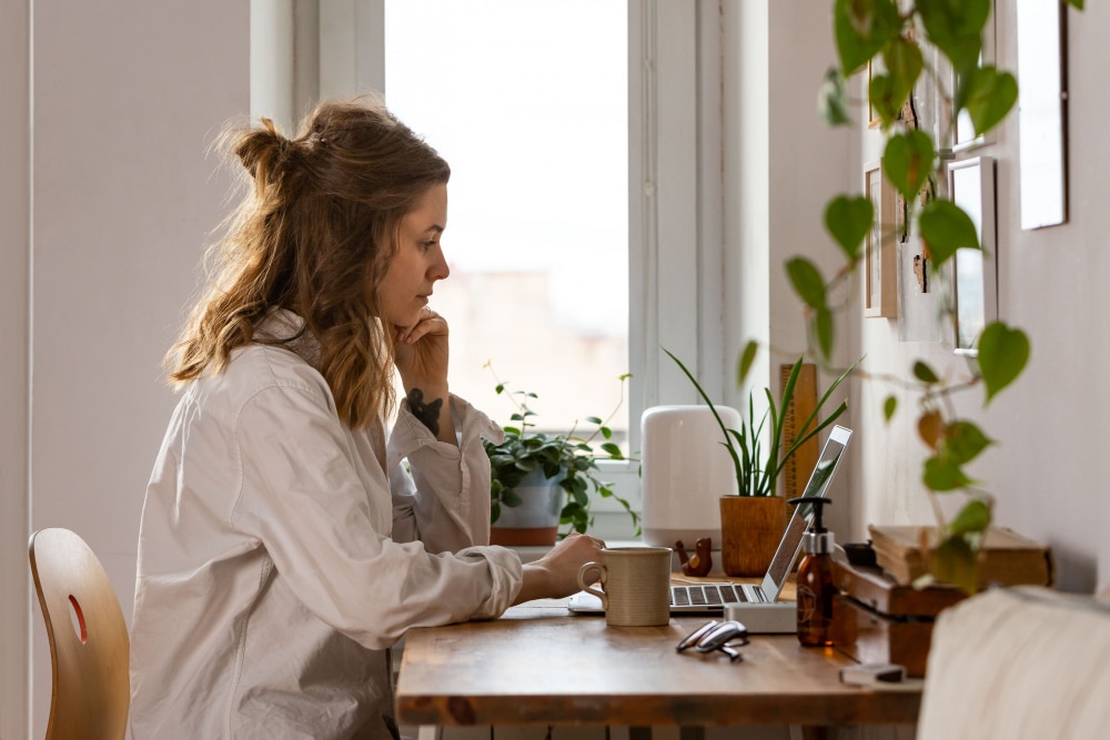 Remote work culture at DonnaPro with executive assistant in professional home office demonstrating deep work focus